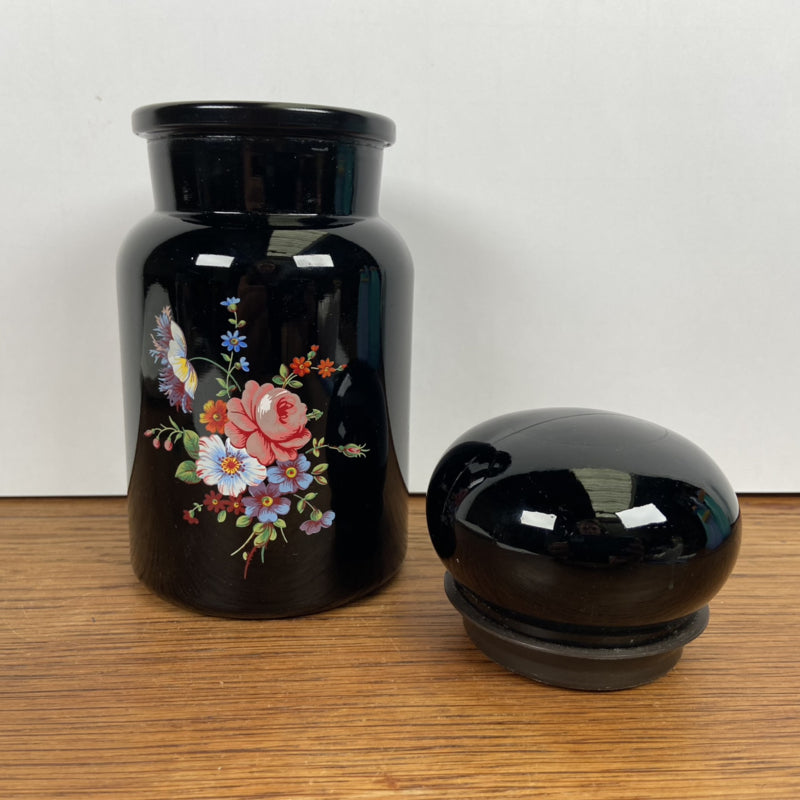 zwarte apothekerspot met bloem