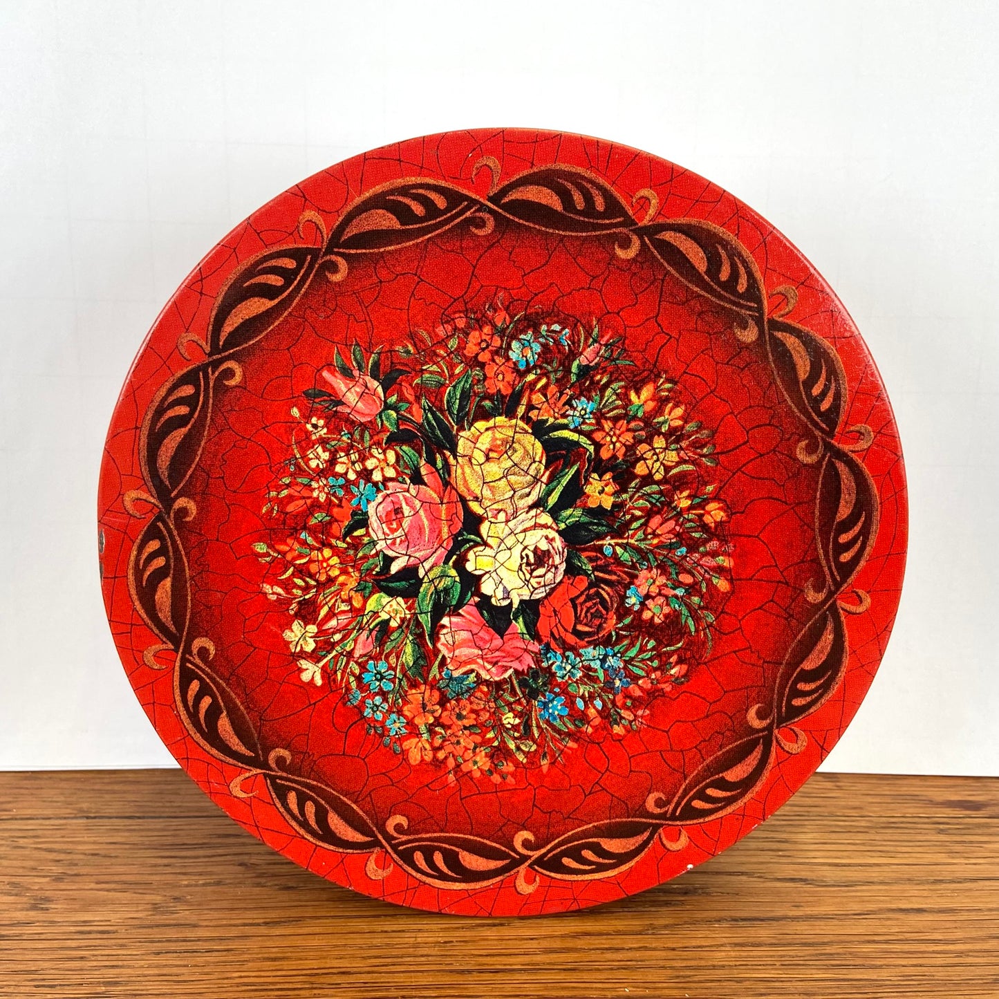 Vintage rond rood blik bloemen