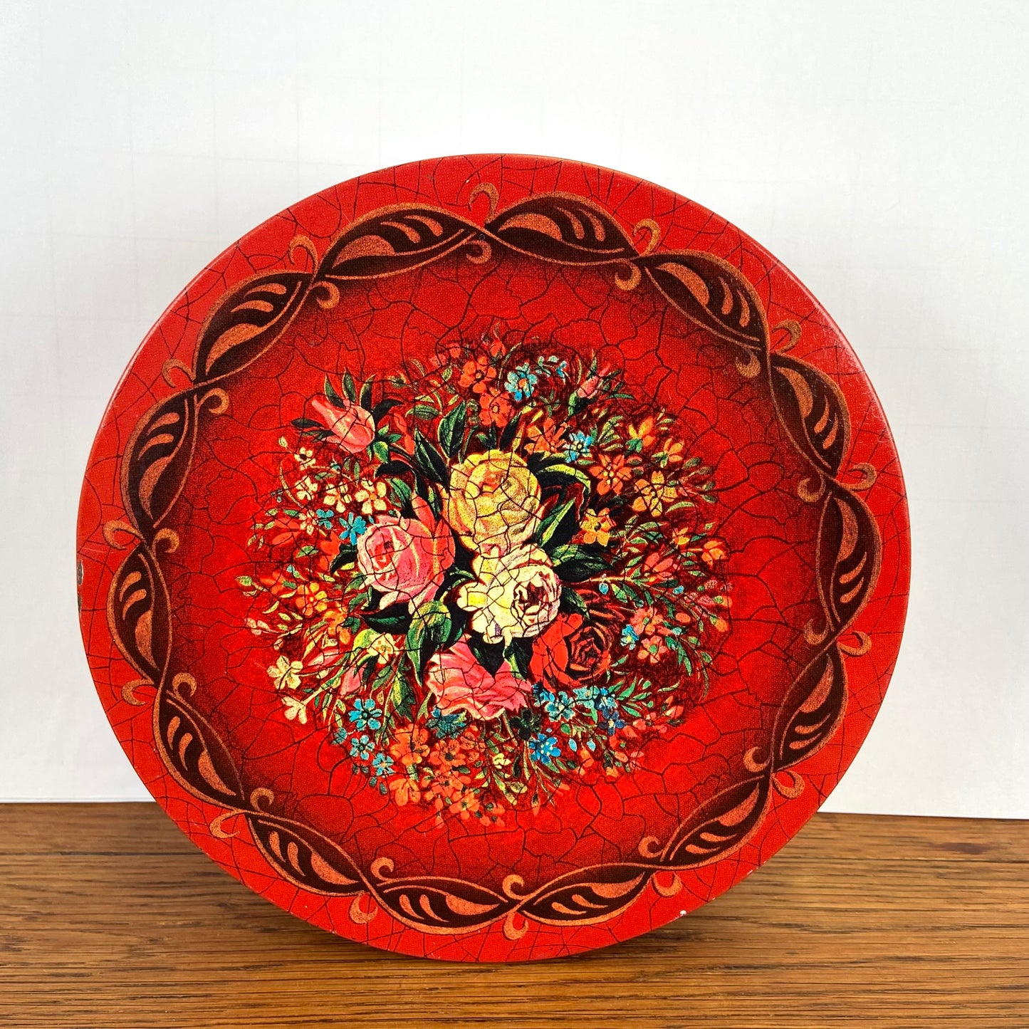 Vintage rond rood blik bloemen