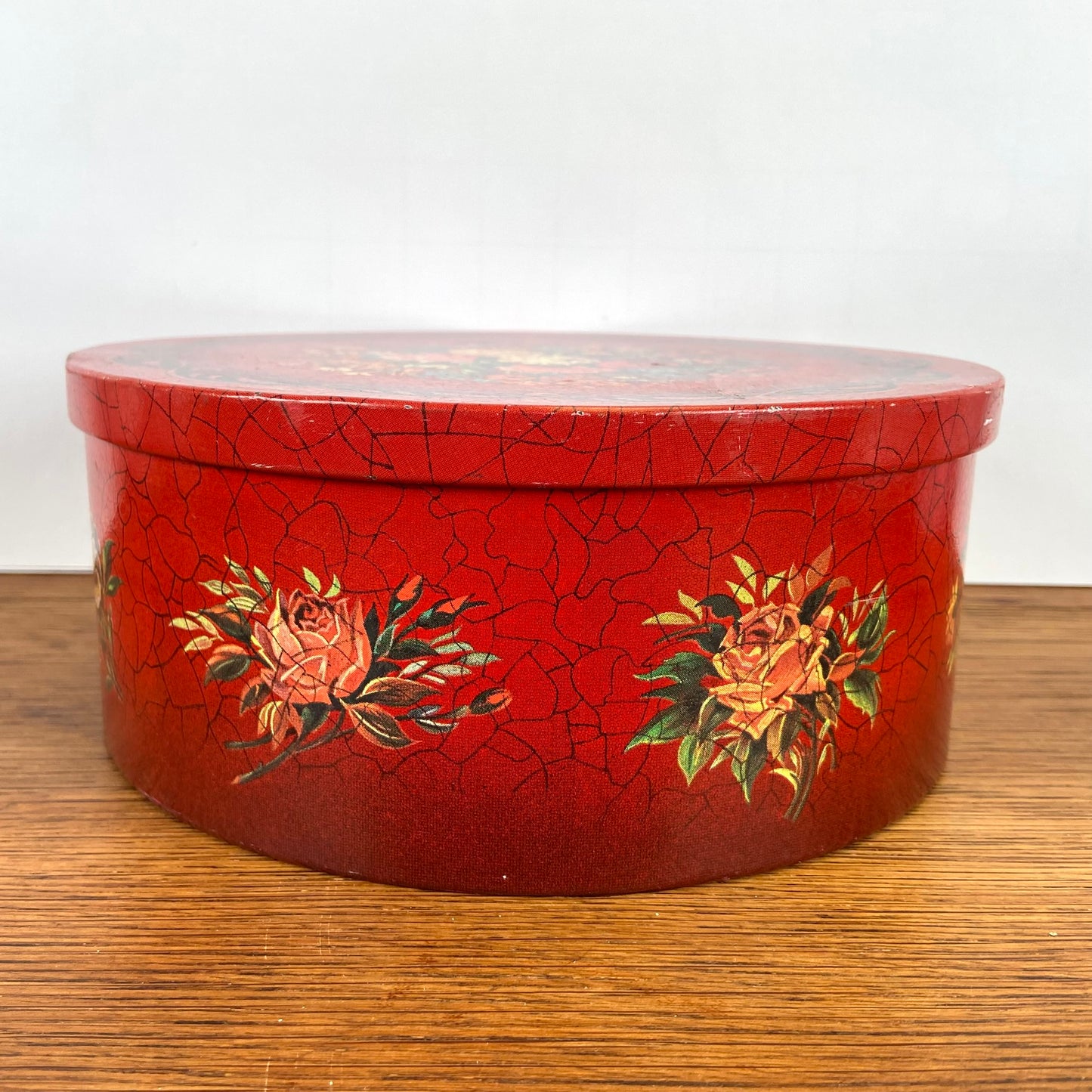Vintage rond rood blik bloemen