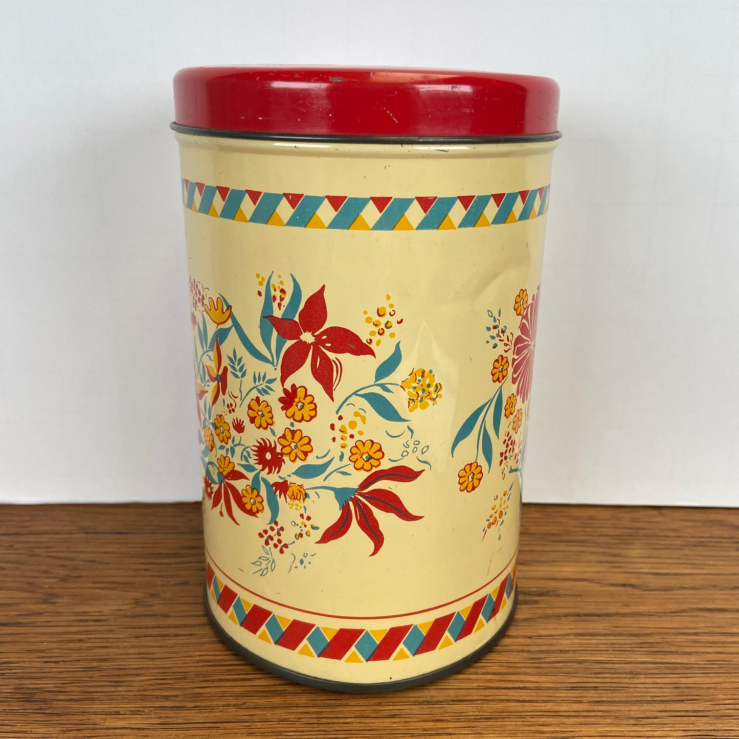 Vintage blik bloemen rode deksel
