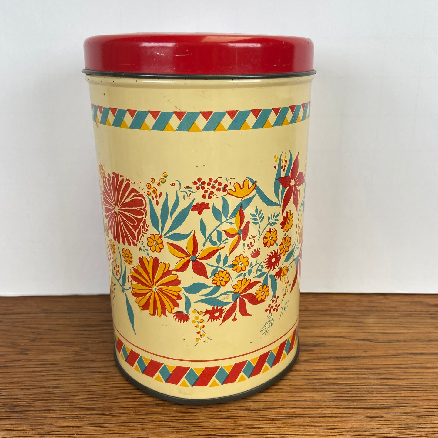 Vintage blik bloemen rode deksel