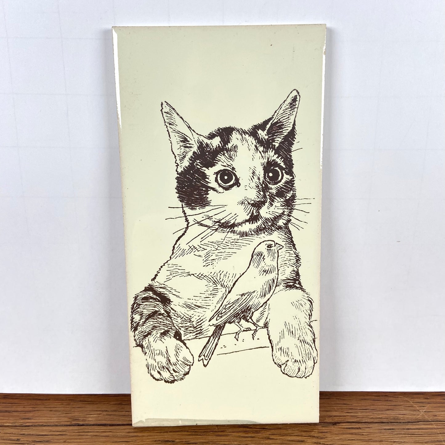 Vintage tegel kat met vogel