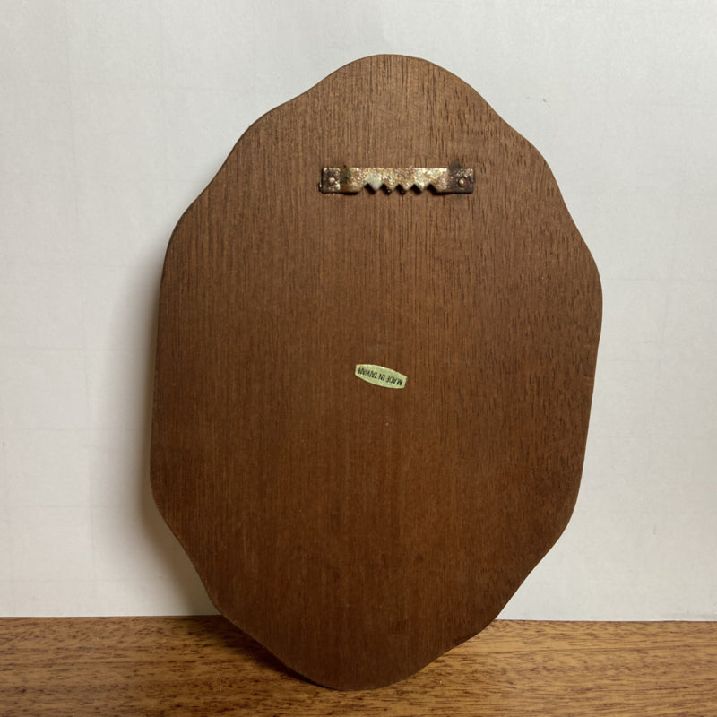 Vintage kunststof wandbordje