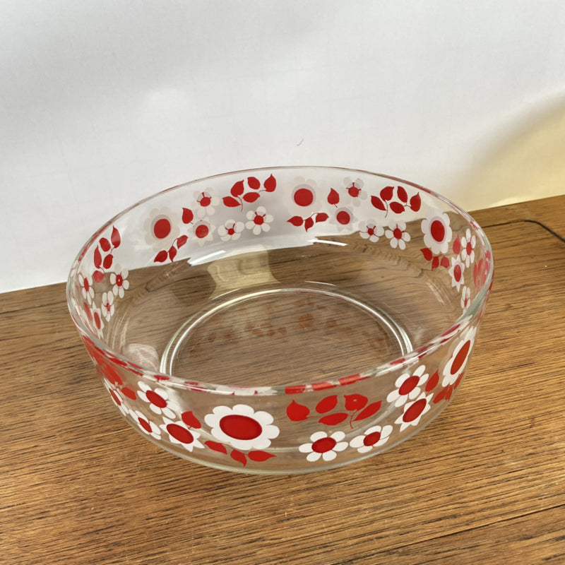 Glazen schaal met rood witte bloemen