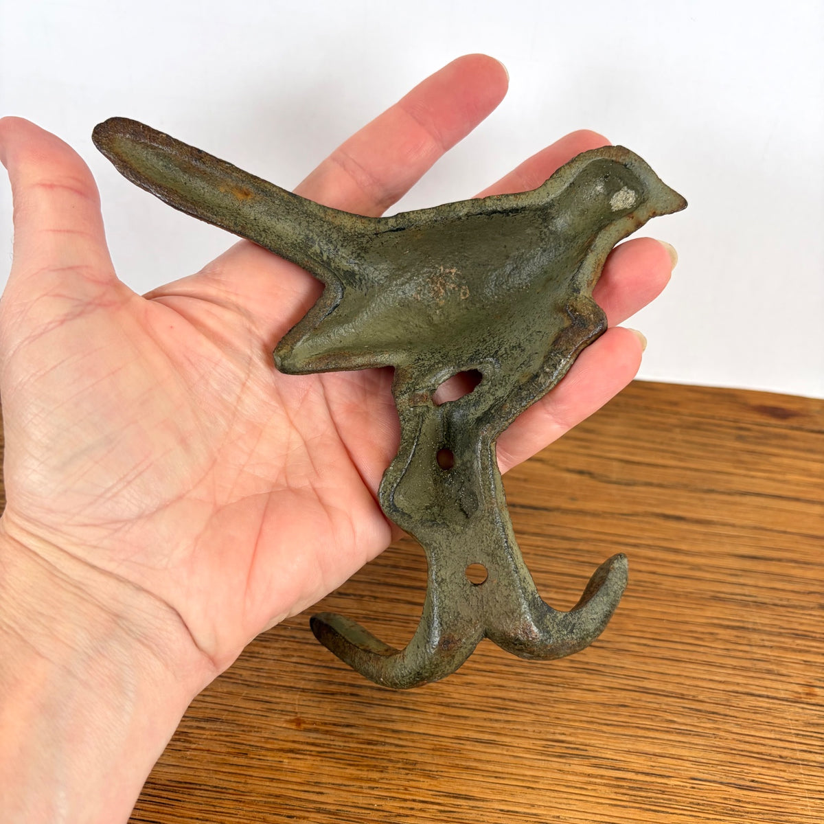 Gietijzeren wandhaak vogel