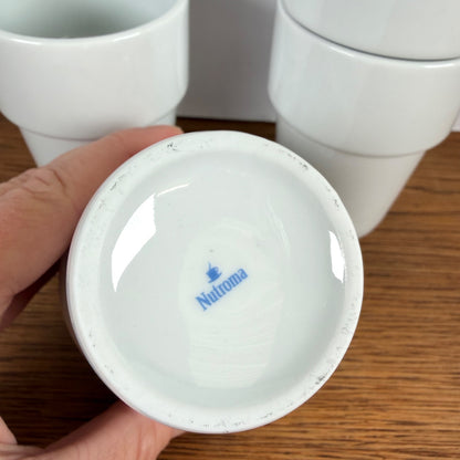 Melkbekers Nutroma met vlinder