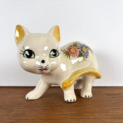 Vintage beeld kat met bloemen