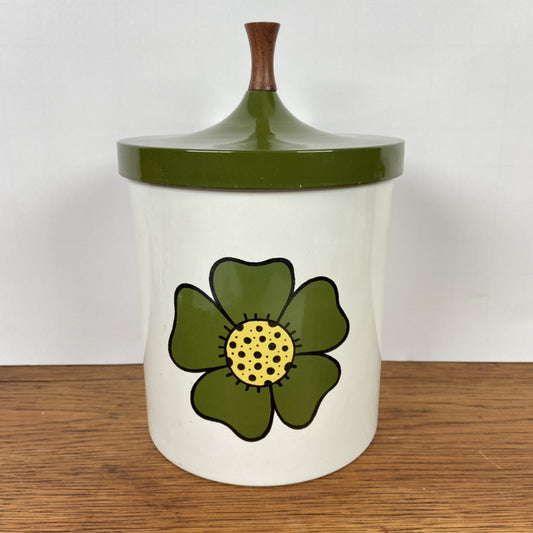 Vintage bewaarblik met groene bloem