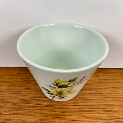 Vintage bloempot gele bloemen