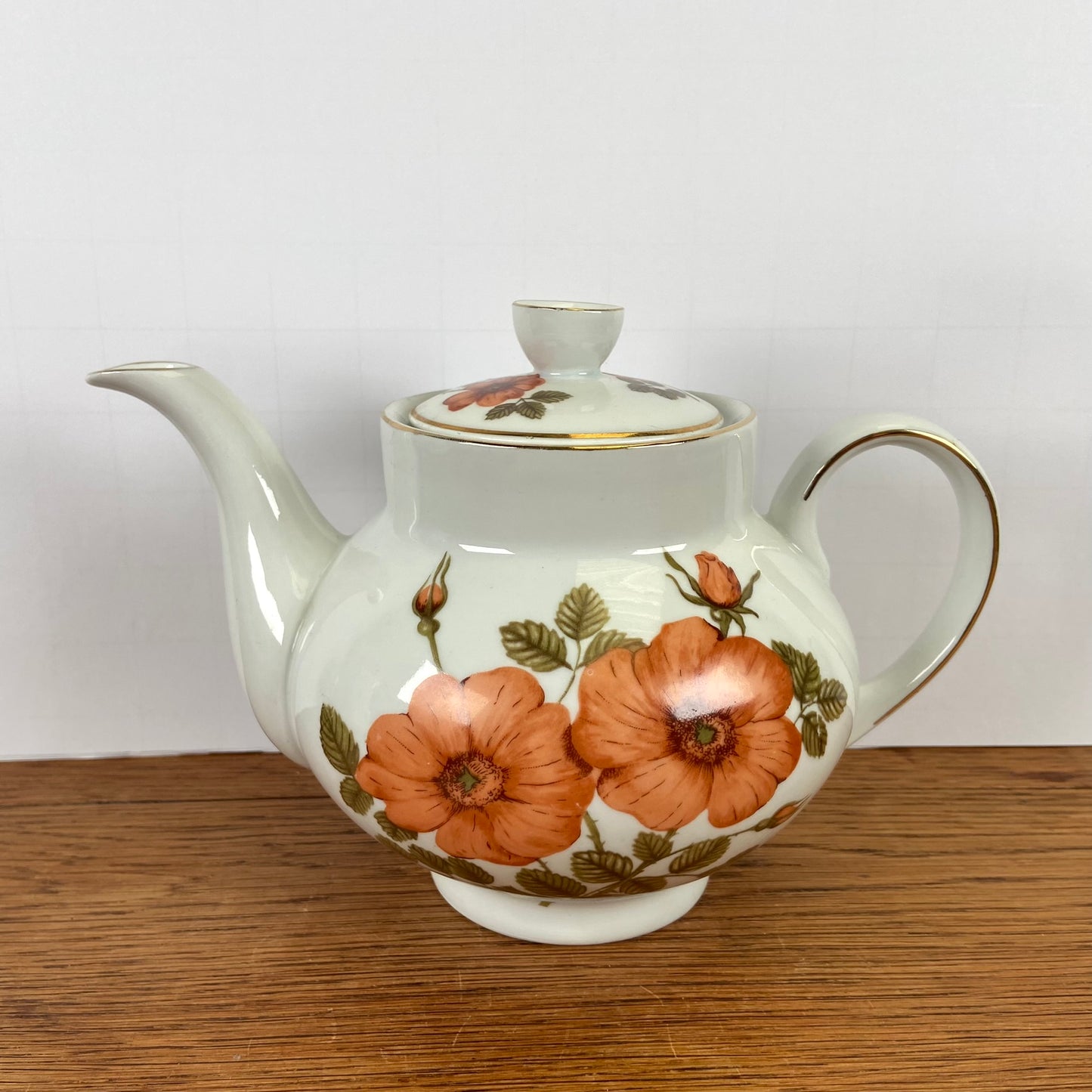 Vintage theepot oranje bloemen