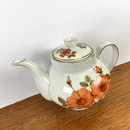 Vintage theepot oranje bloemen