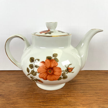 Vintage theepot oranje bloemen