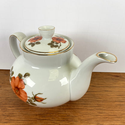 Vintage theepot oranje bloemen