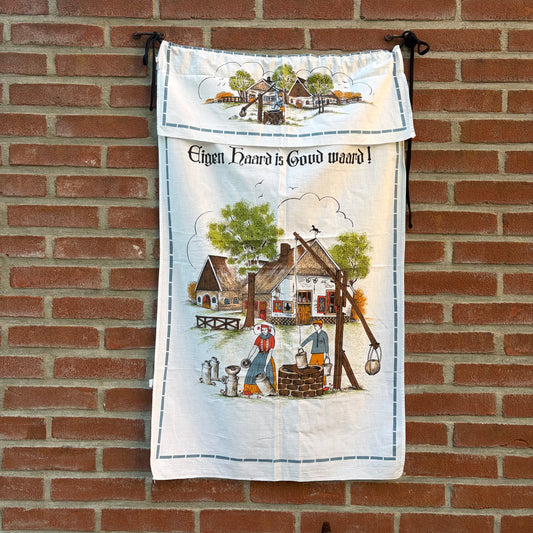 Vintage overhanddoek “Eigen haard is goud waard”