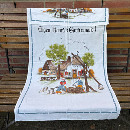 Vintage overhanddoek “Eigen haard is goud waard”