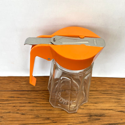 Vintage oranje suikerstrooier
