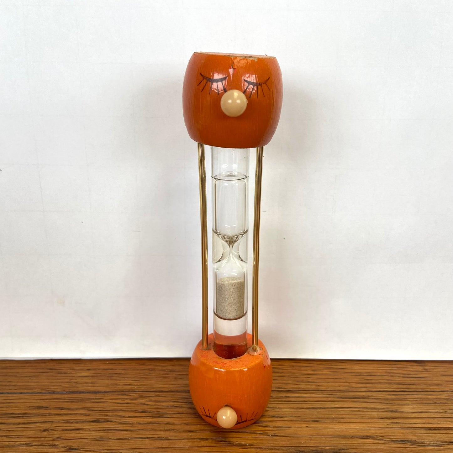 Vintage houten zandloper gezicht