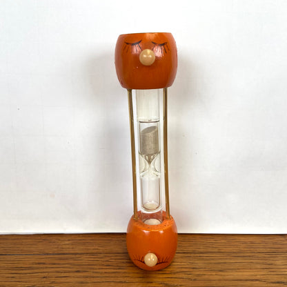 Vintage houten zandloper gezicht