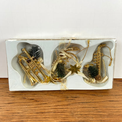 3 messingkleurige muziek hangers