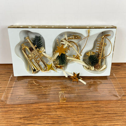 3 messingkleurige muziek hangers