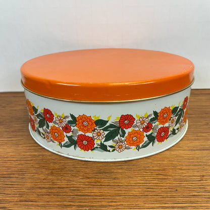Vintage rond koekjesblik oranje