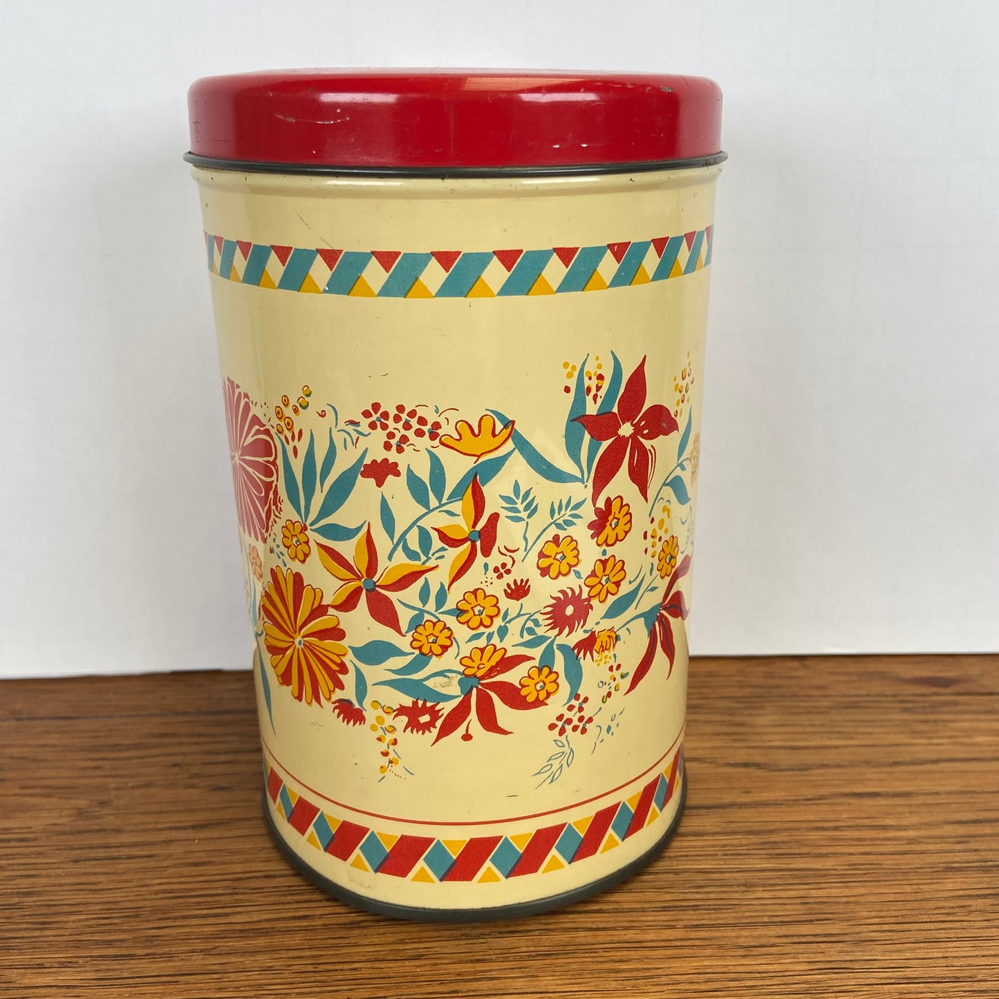 Vintage blik bloemen rode deksel