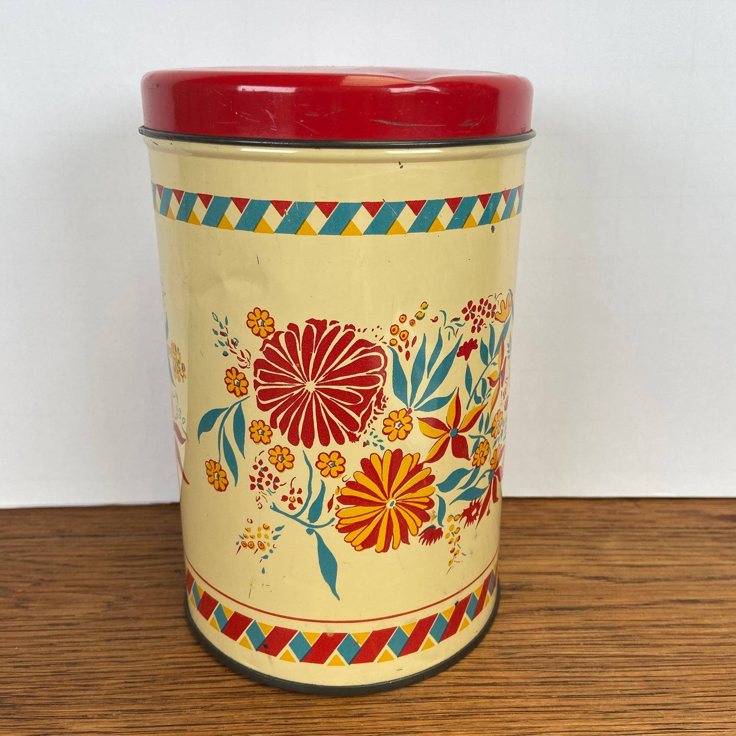 Vintage blik bloemen rode deksel