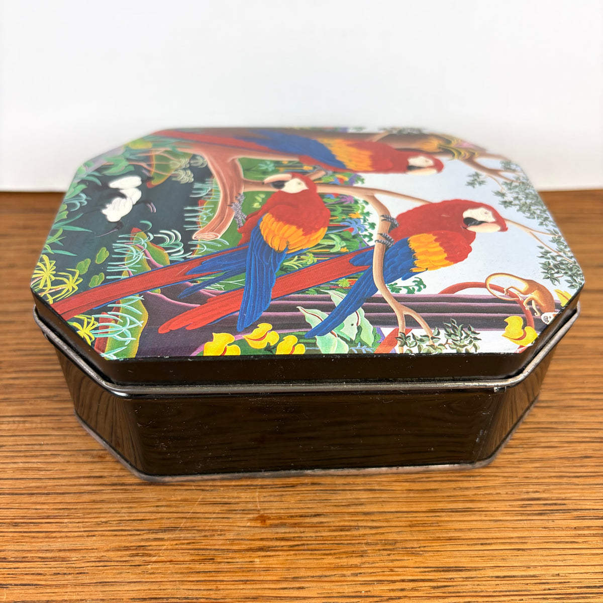 Vintage blikje drie papegaaien jungle