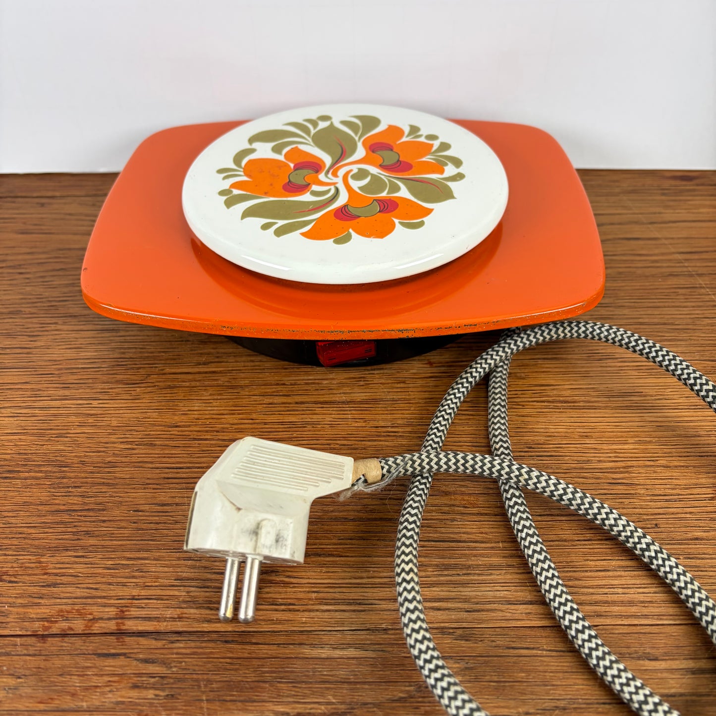 Vintage oranje warmhoud plaatje