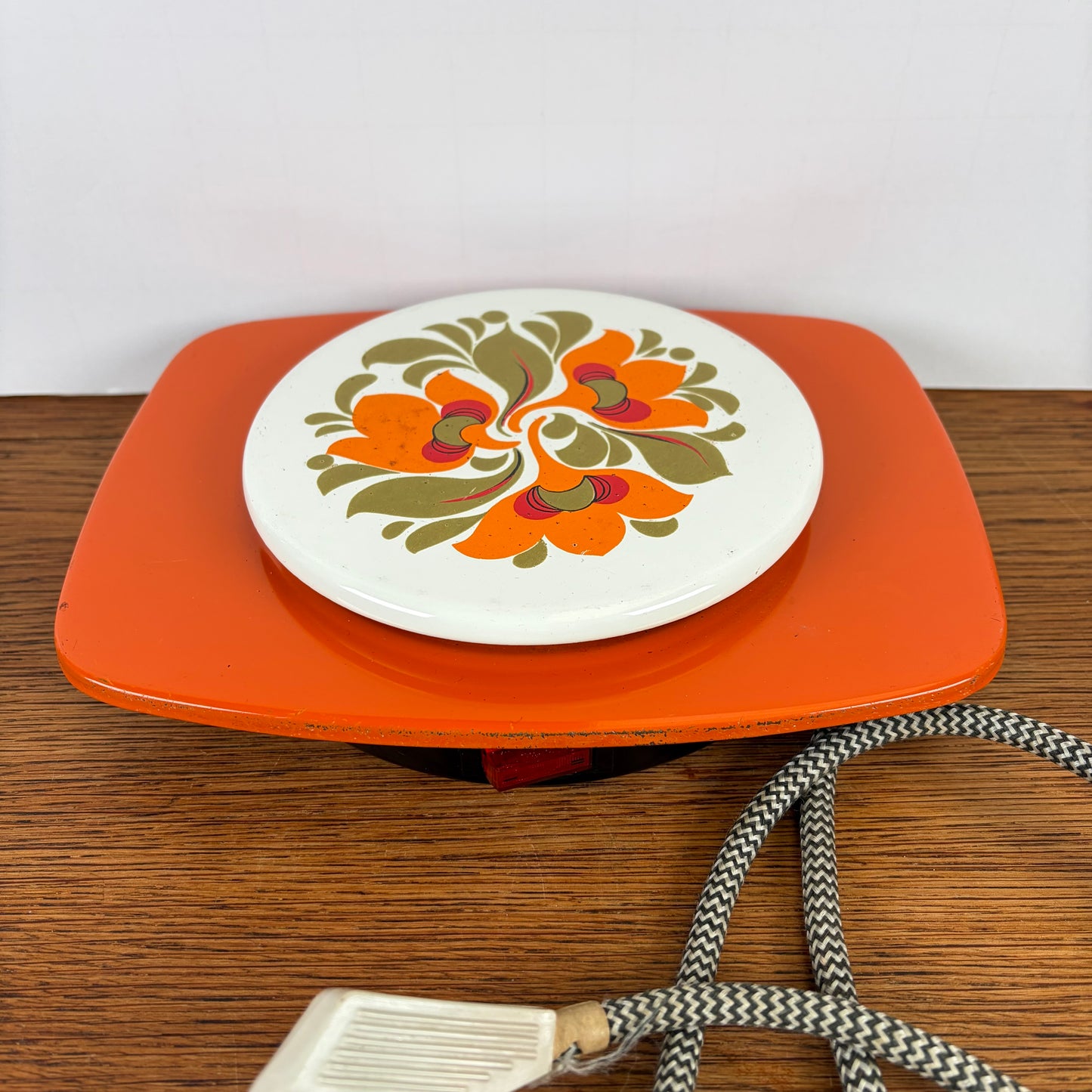 Vintage oranje warmhoud plaatje