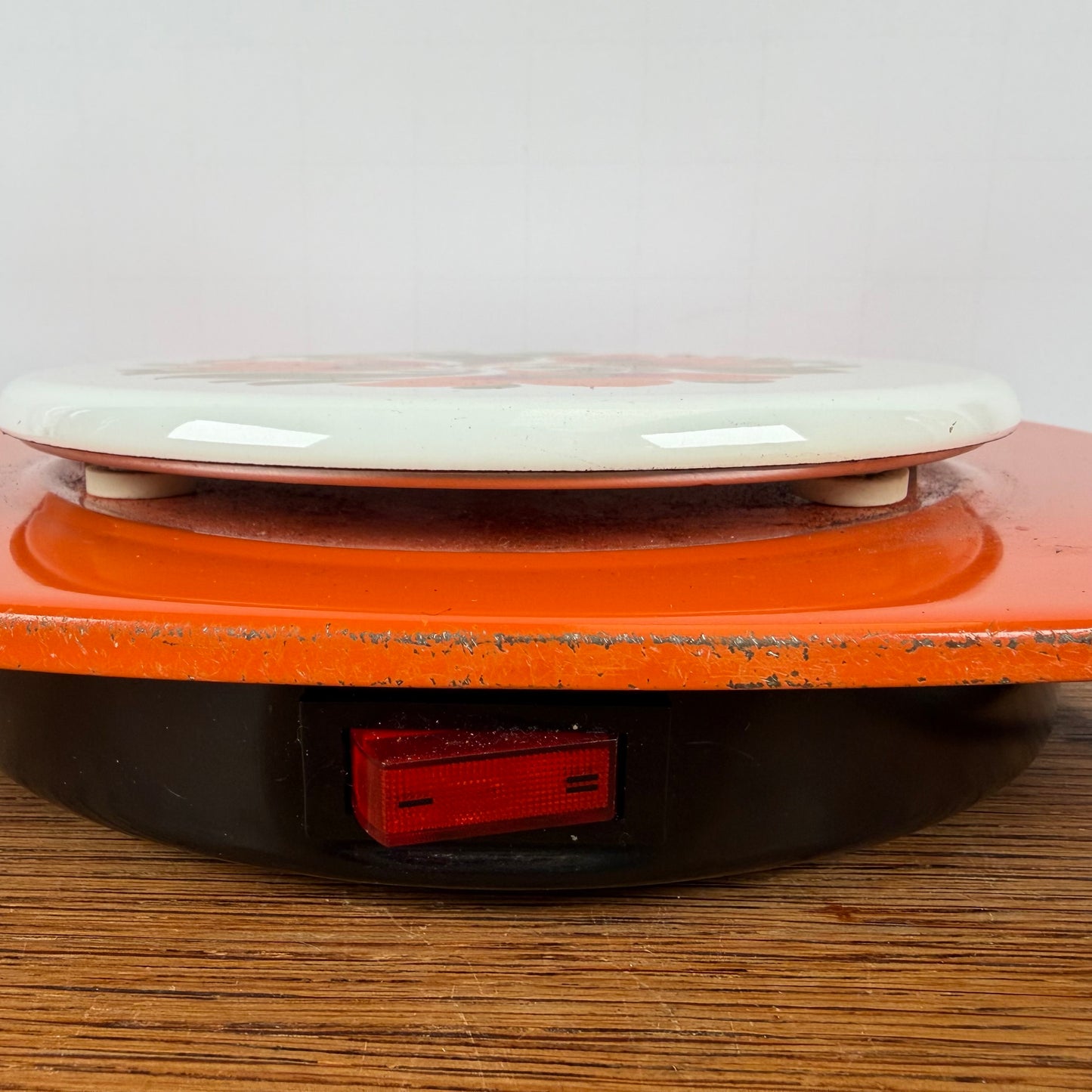 Vintage oranje warmhoud plaatje