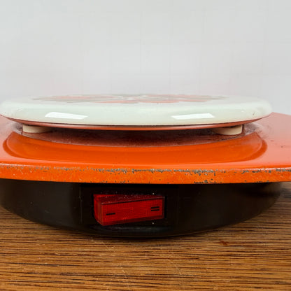 Vintage oranje warmhoud plaatje