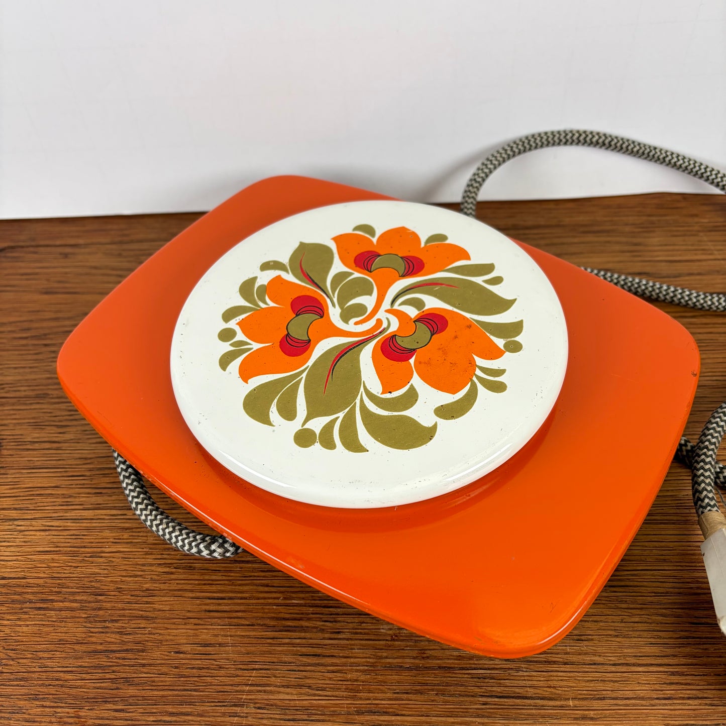 Vintage oranje warmhoud plaatje