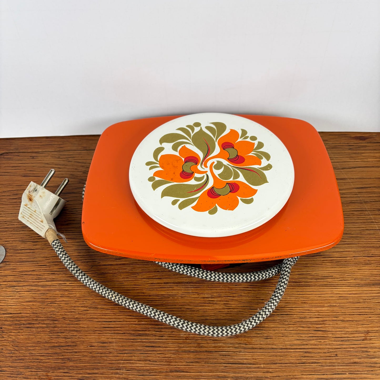 Vintage oranje warmhoud plaatje
