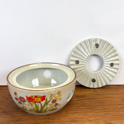 Vintage theepot met theelicht wilde bloemen
