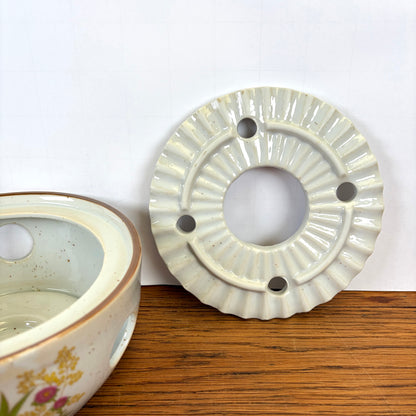 Vintage theepot met theelicht wilde bloemen
