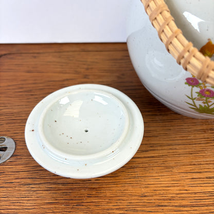 Vintage theepot met theelicht wilde bloemen