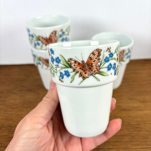 Melkbekers Nutroma met vlinder