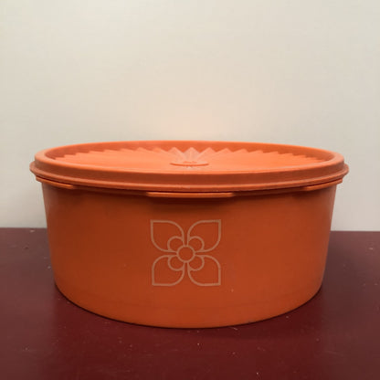 Oranje tupperware bewaardoos bloem