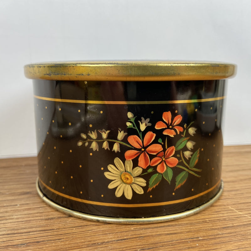 Vintage rond blikje met bloemen