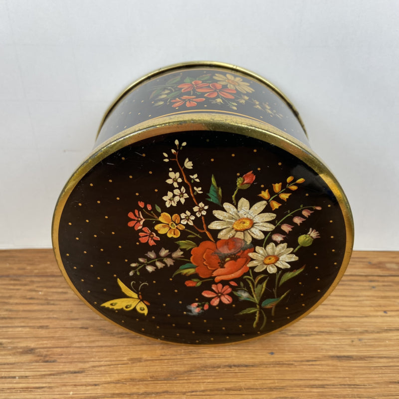 Vintage rond blikje met bloemen