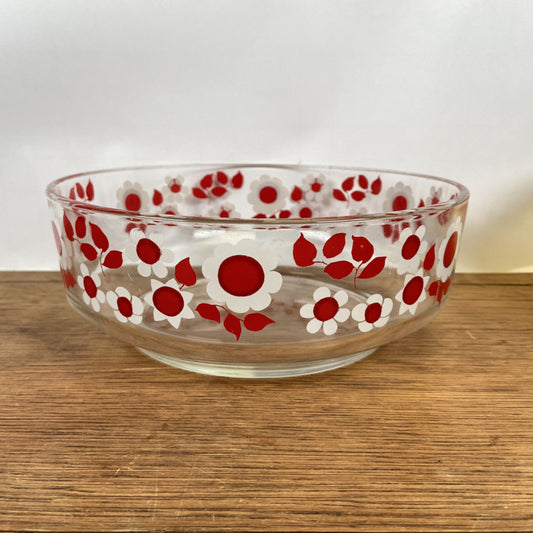 Glazen schaal met rood witte bloemen