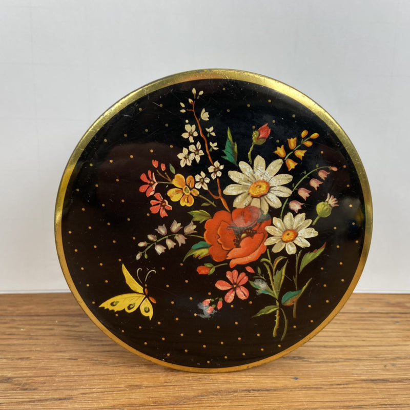 Vintage rond blikje met bloemen