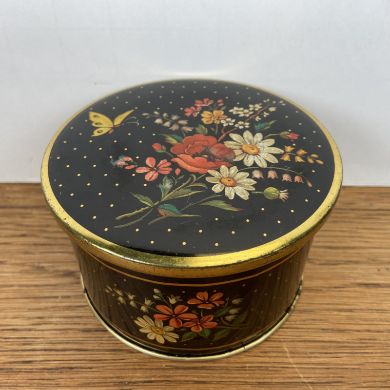 Vintage rond blikje met bloemen